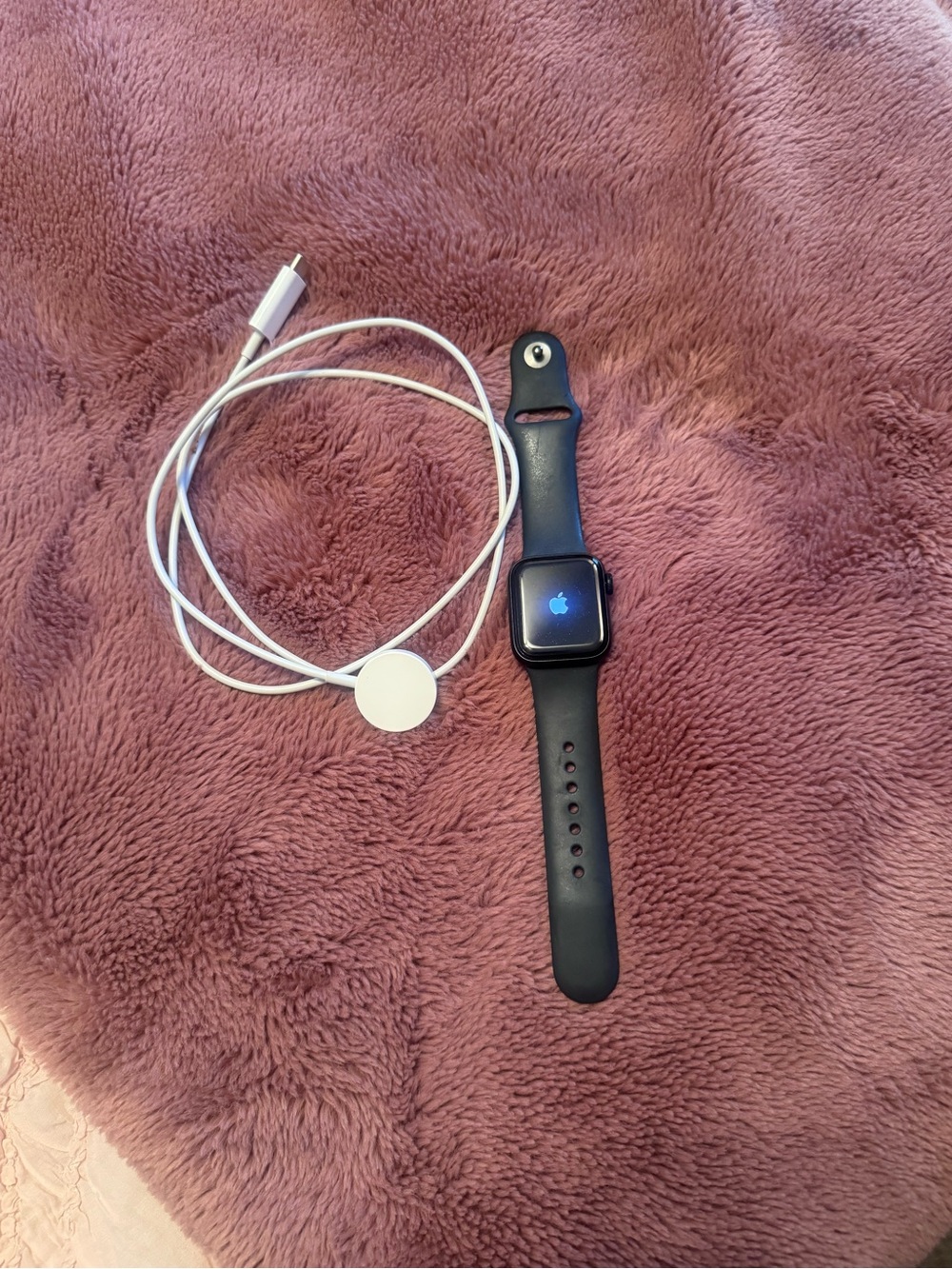 Apple Watch in Black with White Magnetic Charger